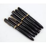 A collection of black Parker cartridge and fountain pens including Victory,