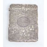 A Victorian hallmarked silver card case with bright cut foliate decoration and inscribed 'M.