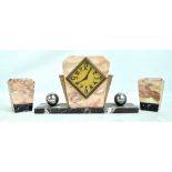 A French Art Deco marble three piece clock garniture, clock width 38.5cm, height 20.5cm.