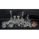 A group of clear cut glass comprising two square section decanters, three ewer decanters,