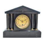 A late Victorian black slate mantel clock of architectural form with Junghans movement, height 27cm.