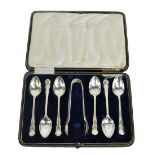 A cased set of six George V hallmarked silver teaspoons with matching sugar tongs, Sheffield 1919,