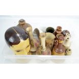 A collection of salt glazed stoneware including a piggy bank, jars and a jelly mould,
