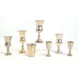 Four variously hallmarked silver bell shaped Kiddush goblets including a silver gilt example by