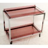 A chromed and purple glass two tier drinks trolley, 65.6 x 79.5 cm.