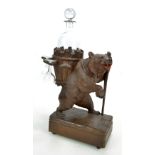 A late 19th century Bavarian Black Forest decanter stand modelled as a bear raised on hind legs