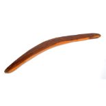 A hardwood boomerang, length 78cm.