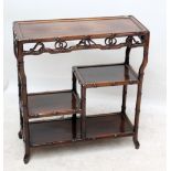 A Chinese hardwood display stand with stepped shelves and bamboo effect edges and supports,