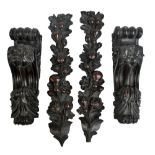 Two pairs of early 20th century carvings taken from pieces of furniture,