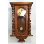 A late 19th/early 20th century walnut Vienna style eight day wall clock,