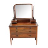 An Edwardian inlaid mahogany dressing chest with mirror back above two short and two long drawers,