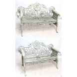 A pair of green painted cast iron garden benches on paw feet, width of each approx 150cm (2).