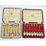 A cased set of eight hallmarked silver and enamel decorated coffee spoons, Birmingham 1951,