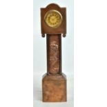 An Arts and Crafts beaten copper miniature longcase clock, with embossed stylised floral decoration,