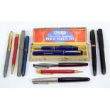 A collection of pens and propelling pencils including Coronation souvenir pen and pencil set by