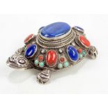 An Eastern 925 silver trinket box modelled as a tortoise decorated with various gem stone cabochons,