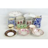 A group of decorative ceramics including two frog mugs, a Sylvac cruet, triangular jug, etc.