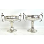 WALKER & CO; a pair of 'Homeland' beaten and polished pewter pedestal bowls,