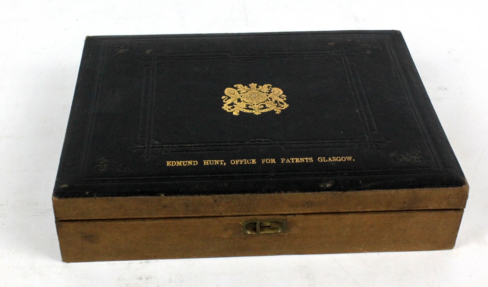A wooden deed box with tooled leather top bearing impressed gilt royal crest and inscribed 'Edmund