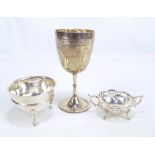 Three variously hallmarked silver items comprising a Victorian trophy goblet engraved with garlands