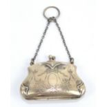 A George V hallmarked silver purse with ribbon tied foliate swag engraved detail,