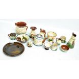 A small collection of Torquay ware including vases and jugs.