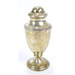 A George V hallmarked silver sugar caster of baluster form raised on spreading circular foot,