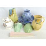 A quantity of decorative ceramics including three wall pockets, large Beswick jug, etc.