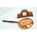 An Edwardian mahogany domed mantel clock, the circular dial set with Arabic numerals, width 30.