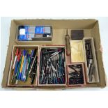 A group of pen repair tools and spare parts including a large quantity of fountain pen reservoirs,