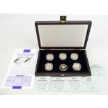 A cased Queen Mother themed set comprising five 925 silver coins (each 15.