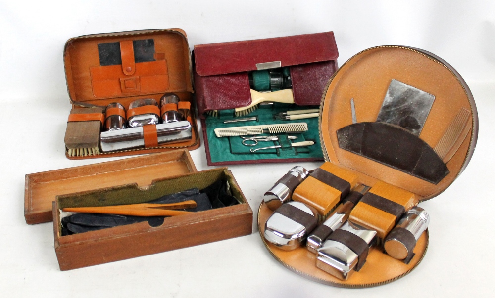 An Edwardian wooden glove box with two pairs of gloves,