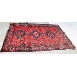 A modern Iranian handmade woollen red/blue ground carpet by Tribal Rugs Ltd, 300 x 212cm.
