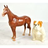 Two Royal Doulton figures; seated bulldog, height 12.75cm, and RDA118 'Irish Hunter' (2).