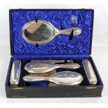 HL BROWN & SON; An Edward VII hallmarked silver six piece dressing table set comprising hand mirror,