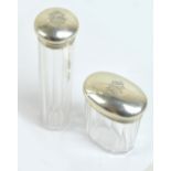 DREW & SONS; an Edward VII hallmarked silver topped clear cut glass oval dressing table jar,