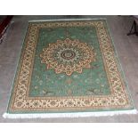 A green ground Keshan carpet, 280 x 200cm.