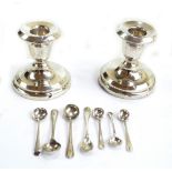 MARSON & JONES; a pair of George V hallmarked silver loaded candlesticks with bell shaped sconces,