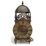 An 18th century brass lantern clock, the chapter ring set with Roman numerals,