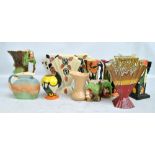 A quantity of decorative jugs and vases including a large Eastgate squirrel moulded jug,