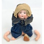 A late 19th/early 20th century German bisque headed doll marked 'Made in Germany' to the back of