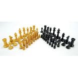 A loaded turned fruitwood chess set, height of king 9.4cm, and a further example (2).