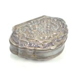 A late 18th/early 19th century Continental white metal snuff box with embossed decoration and