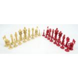 A late 19th/early 20th century Chinese Export elaborately carved ivory and stained ivory chess set,