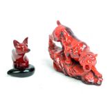 A Royal Doulton flambé figure of a seated fox, height 11.