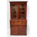 A mahogany bureau bookcase with twin glazed doors enclosing three shelves above single long drawer