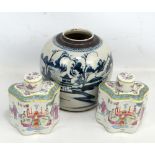 A pair of Chinese Republic Famille Rose tea caddies and covers with figural decoration, height 16cm,