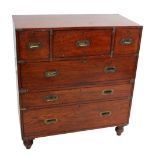 An Army & Navy CSL teak and brass bound campaign chest with secrétaire and short drawers above