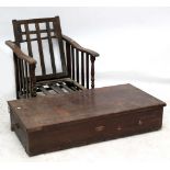 An oak reclining chair, width 64cm, and a storage box, width 122cm (2).