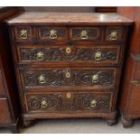 An 18th century mahogany crossbanded chest of four short and three long drawers with later carved